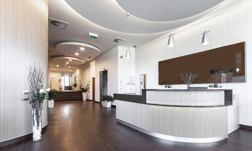 Picture of a dental office interior representing the dental services of the Costa Rica Dental Center in San Jose, Costa Rica. The interior is very modern and has soft brown and white colors.